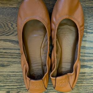 Tory Burch flats, camel colored with logo on heels